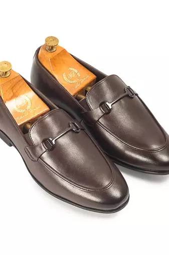 Brown synthetic buckle slipons