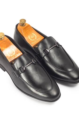 Black synthetic buckle slipons