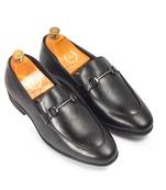 Black synthetic buckle slipons