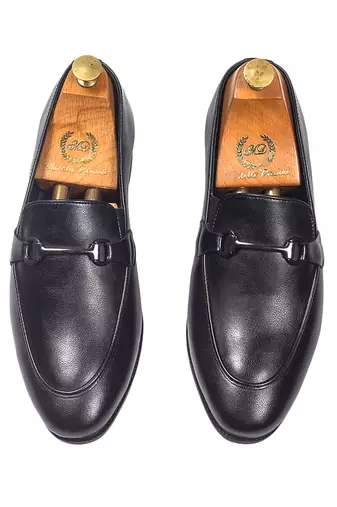 Black synthetic buckle slipons