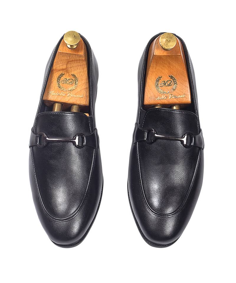 Black synthetic buckle slipons