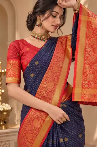 festive silk blend saree featuring a rich woven border paired with a matching blouse