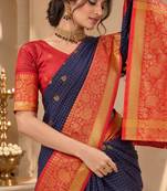 festive silk blend saree featuring a rich woven border paired with a matching blouse