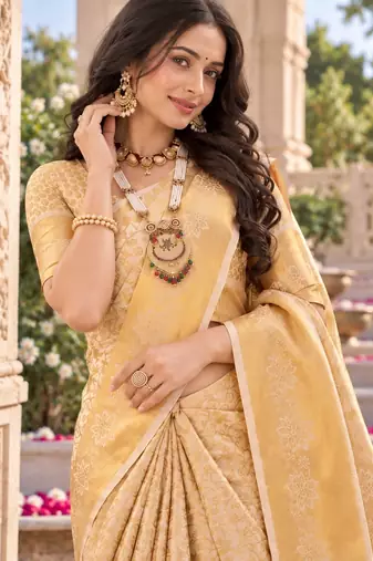 traditional silk blend saree adorned with intricate zari weaving and a beautifully matching blouse