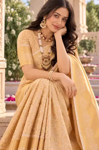traditional silk blend saree adorned with intricate zari weaving and a beautifully matching blouse
