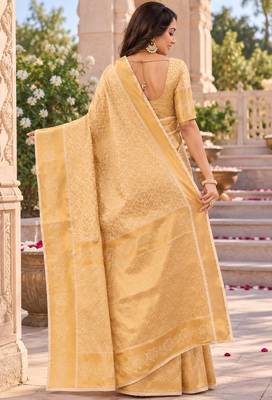 traditional silk blend saree adorned with intricate zari weaving and a beautifully matching blouse 5