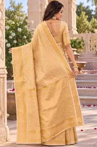 traditional silk blend saree adorned with intricate zari weaving and a beautifully matching blouse