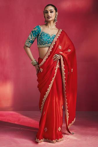crimson red silk blend saree with teal blue embroidered blouse & zari border