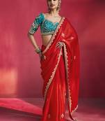 crimson red silk blend saree with teal blue embroidered blouse & zari border
