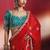 crimson red silk blend saree with teal blue embroidered blouse & zari border