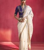 white silk blend saree with purple embroidered blouse & zari border