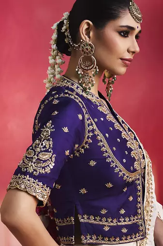 white silk blend saree with purple embroidered blouse & zari border