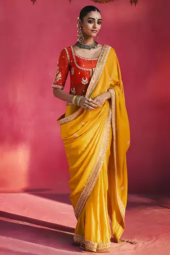 mustard yellow silk blend saree with red embroidered blouse & zari border