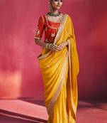 mustard yellow silk blend saree with red embroidered blouse & zari border