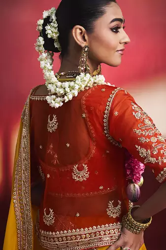 mustard yellow silk blend saree with red embroidered blouse & zari border