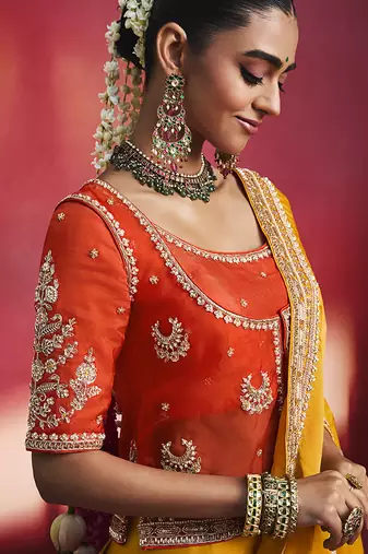 mustard yellow silk blend saree with red embroidered blouse & zari border