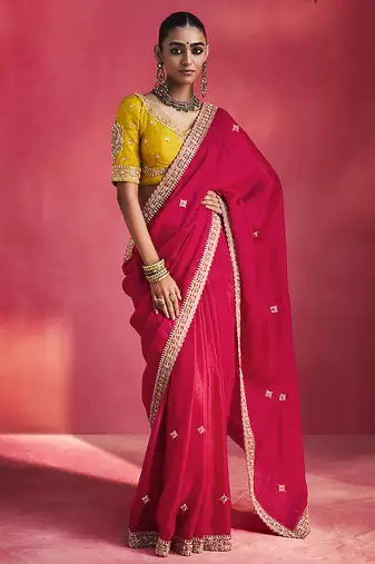 rani pink silk blend saree with mustard yellow embroidered blouse & zari border