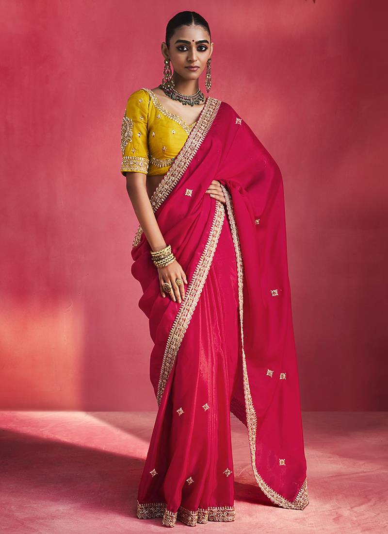 rani pink silk blend saree with mustard yellow embroidered blouse & zari border