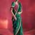 bottle green silk blend saree with rani pink embroidered blouse & zari border