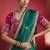 bottle green silk blend saree with rani pink embroidered blouse & zari border