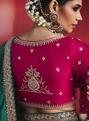 bottle green silk blend saree with rani pink embroidered blouse & zari border 4
