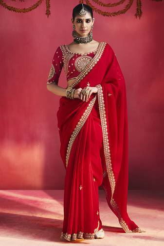 red silk blend saree with gold embroidered border & designer blouse