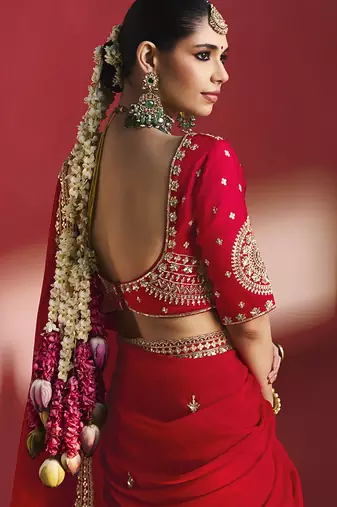red silk blend saree with gold embroidered border & designer blouse