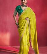lime green silk blend saree with bottle green embroidered blouse & zari border