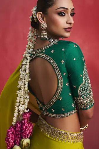 lime green silk blend saree with bottle green embroidered blouse & zari border