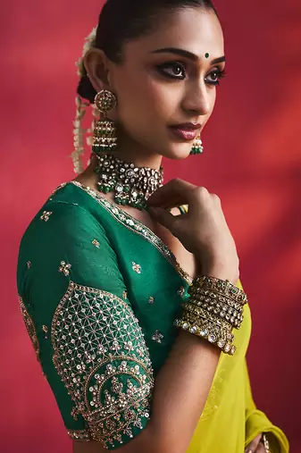 lime green silk blend saree with bottle green embroidered blouse & zari border