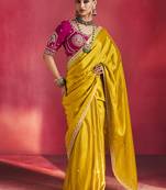 mustard yellow silk blend saree with rani pink embroidered blouse & zari border