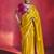 mustard yellow silk blend saree with rani pink embroidered blouse & zari border