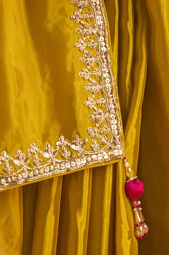 mustard yellow silk blend saree with rani pink embroidered blouse & zari border