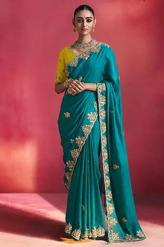 teal blue silk blend saree with yellow embroidered blouse & zari border
