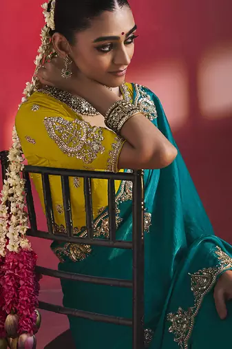 teal blue silk blend saree with yellow embroidered blouse & zari border