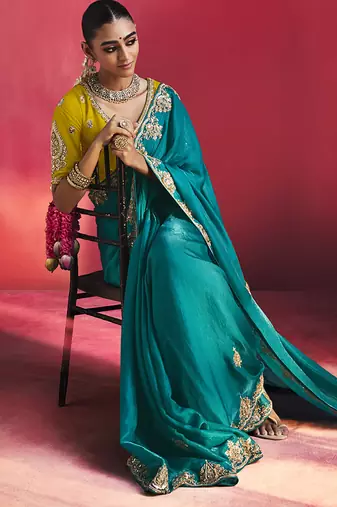 teal blue silk blend saree with yellow embroidered blouse & zari border