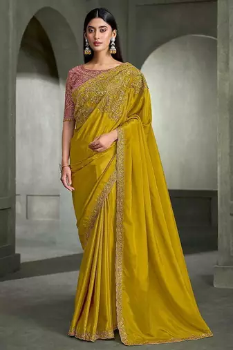 mustard yellow faux crepe embroidered saree with onion pink blouse