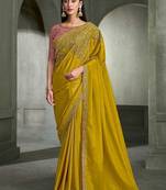 mustard yellow faux crepe embroidered saree with onion pink blouse