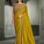 mustard yellow faux crepe embroidered saree with onion pink blouse