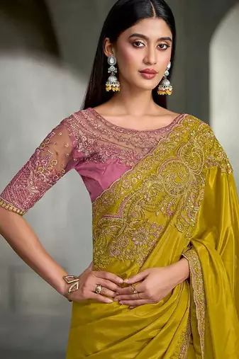 mustard yellow faux crepe embroidered saree with onion pink blouse