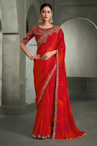 red and orange shaded faux chiffon saree with zari embroidered blouse