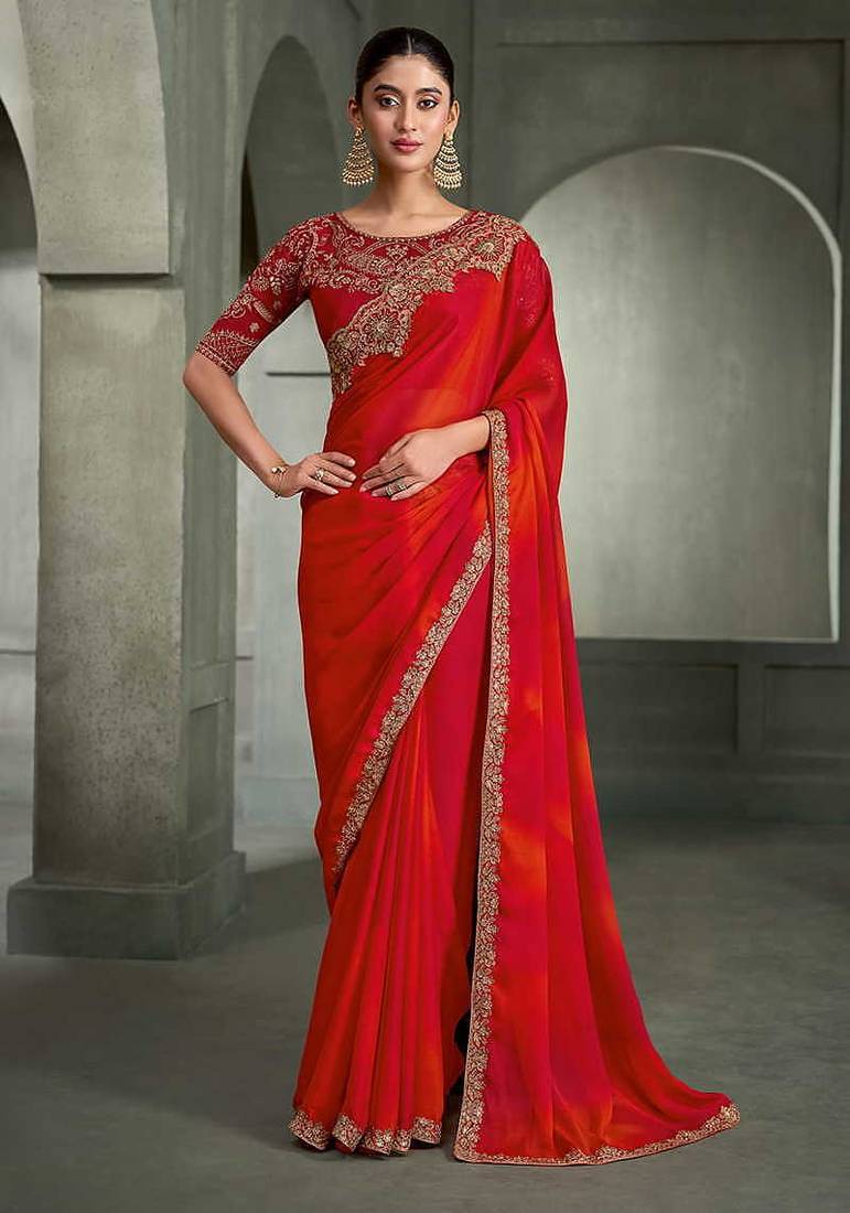 red and orange shaded faux chiffon saree with zari embroidered blouse