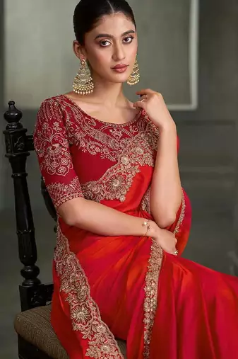 red and orange shaded faux chiffon saree with zari embroidered blouse