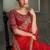 red and orange shaded faux chiffon saree with zari embroidered blouse