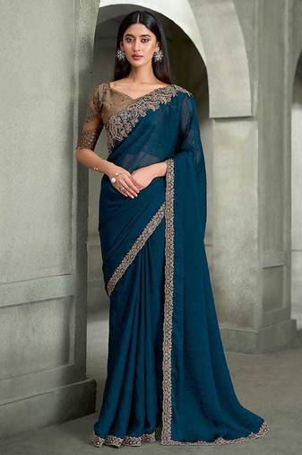 teal blue faux georgette saree with antique gold embroidered border