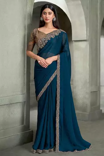 teal blue faux georgette saree with antique gold embroidered border