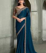 teal blue faux georgette saree with antique gold embroidered border