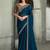 teal blue faux georgette saree with antique gold embroidered border