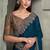teal blue faux georgette saree with antique gold embroidered border