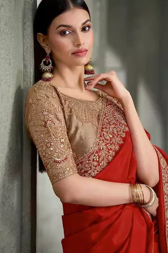 crimson red faux crepe saree with embroidered pallu and border